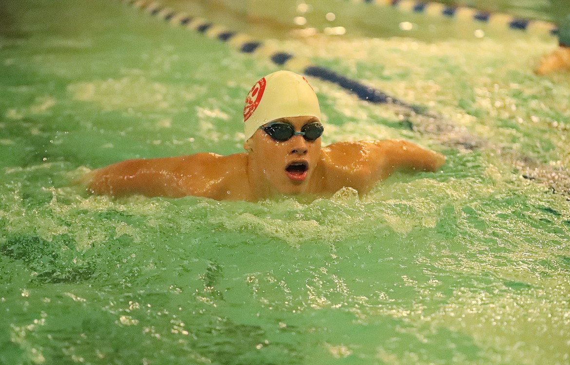 Luc LeBlanc competes in the 100 butterfly on Friday.