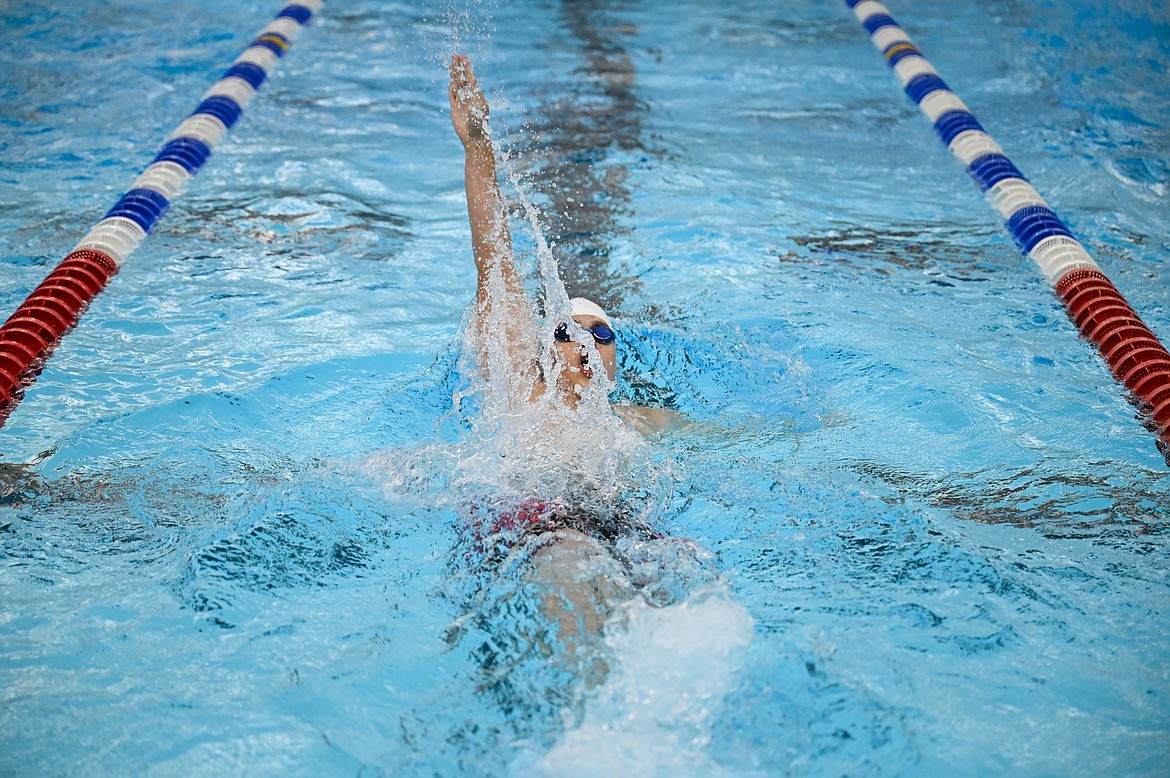 Luc LeBlanc swims the backstroke on Saturday.