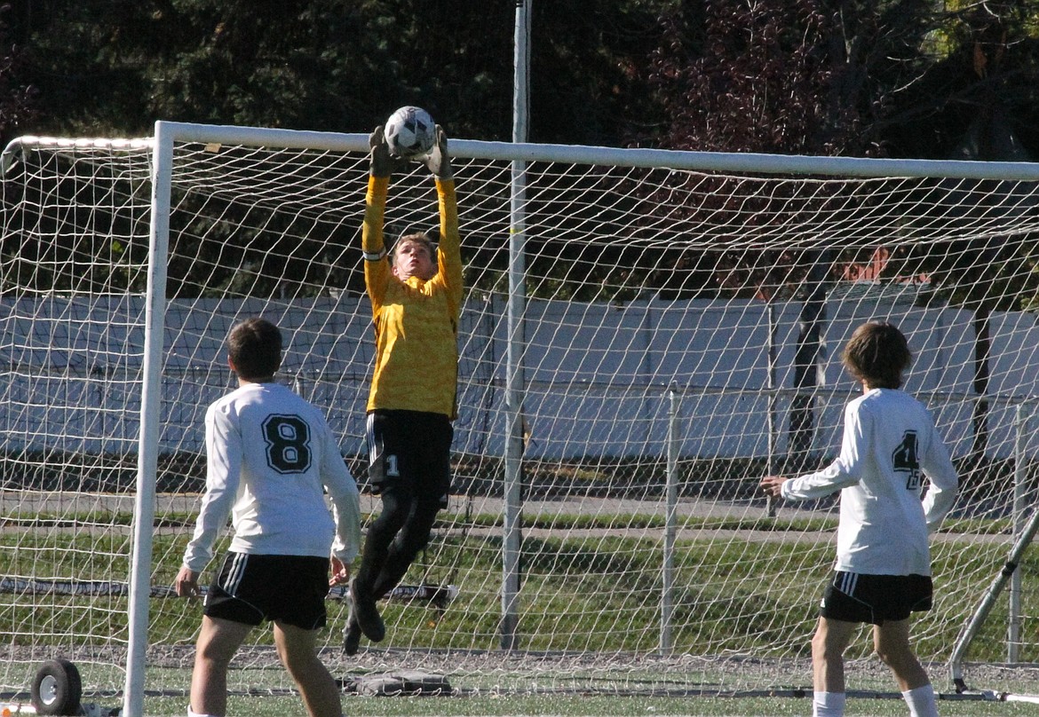 MARK NELKE/Press
St. Maries goalkeeper Greyson Sands soars to make one of his 19 saves against Priest River in the first round of the 3A District 1-2 boys soccer tournament Monday at The Fields at Real Life in Post Falls, as Lumberjack teammates Remy Ballew (8) and Connor Wolfe (4) look on.