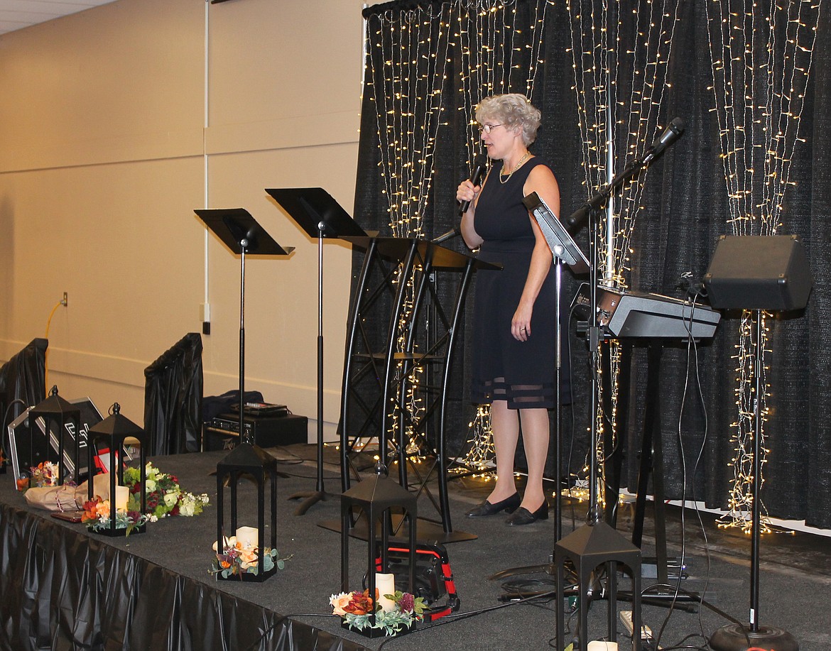 Crossroads Executive Director Carol Knopp talks about the status of the center at the fundraising banquet Saturday.