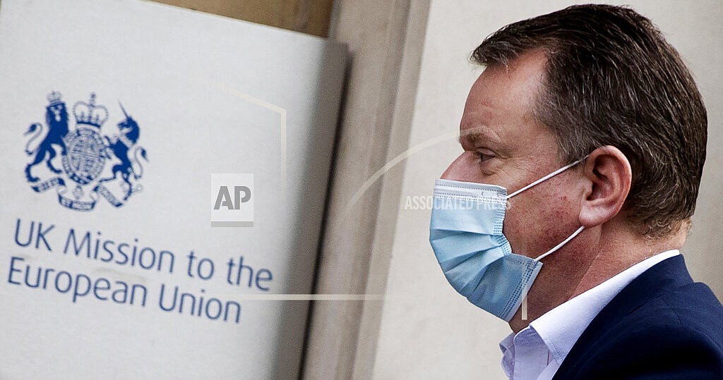 In this Saturday, Dec. 19, 2020 file photo, Britain's chief negotiator David Frost arrives at the UK delegation office for Brexit talks in Brussels. It was late on Christmas Eve last year when the European Union and Britain finally clinched a Brexit trade deal after years of wrangling, threats and missed deadlines to seal their divorce.There was hope that now-separated Britain and the 27-nation bloc would sail their relationship toward calmer waters. Don't even think about it. Such was the bile and bad blood stirred up by the diplomatic brinkmanship and bitter divorce that, two months from another Christmas, insults of treachery and duplicitousness are flying again. (AP Photo/Virginia Mayo, File)