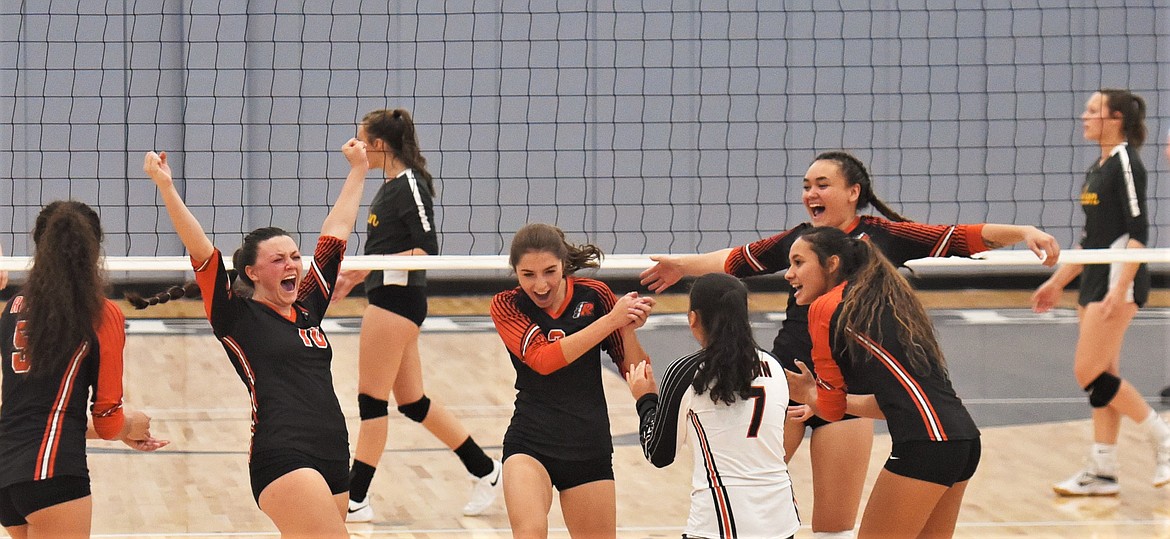 Ronan players celebrate a point against Polson. (Scot Heisel/Lake County Leader)