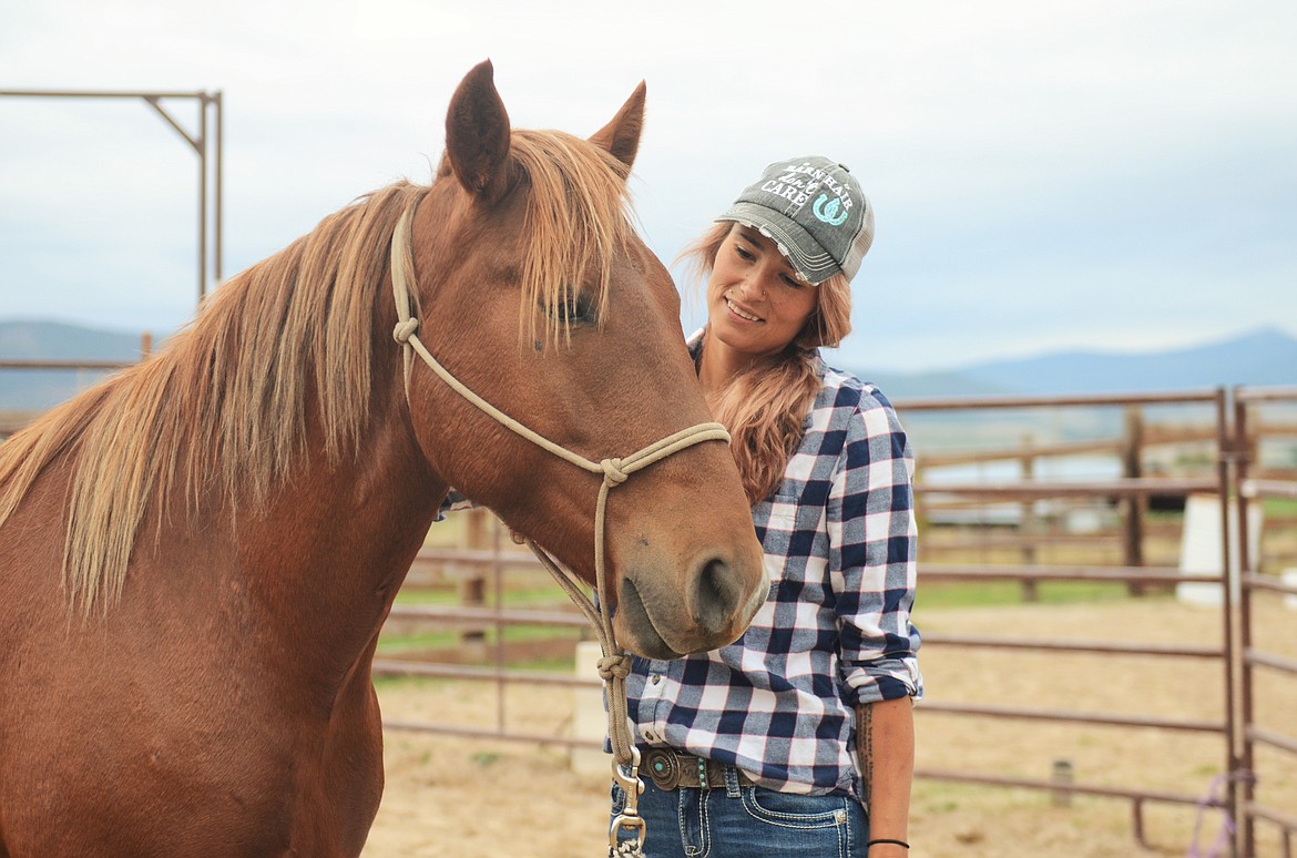 April Crissman is learning from Julio Maldonado to teach and communicate on a horse's terms, with no stress. (Carolyn Hidy/Lake County Leader)