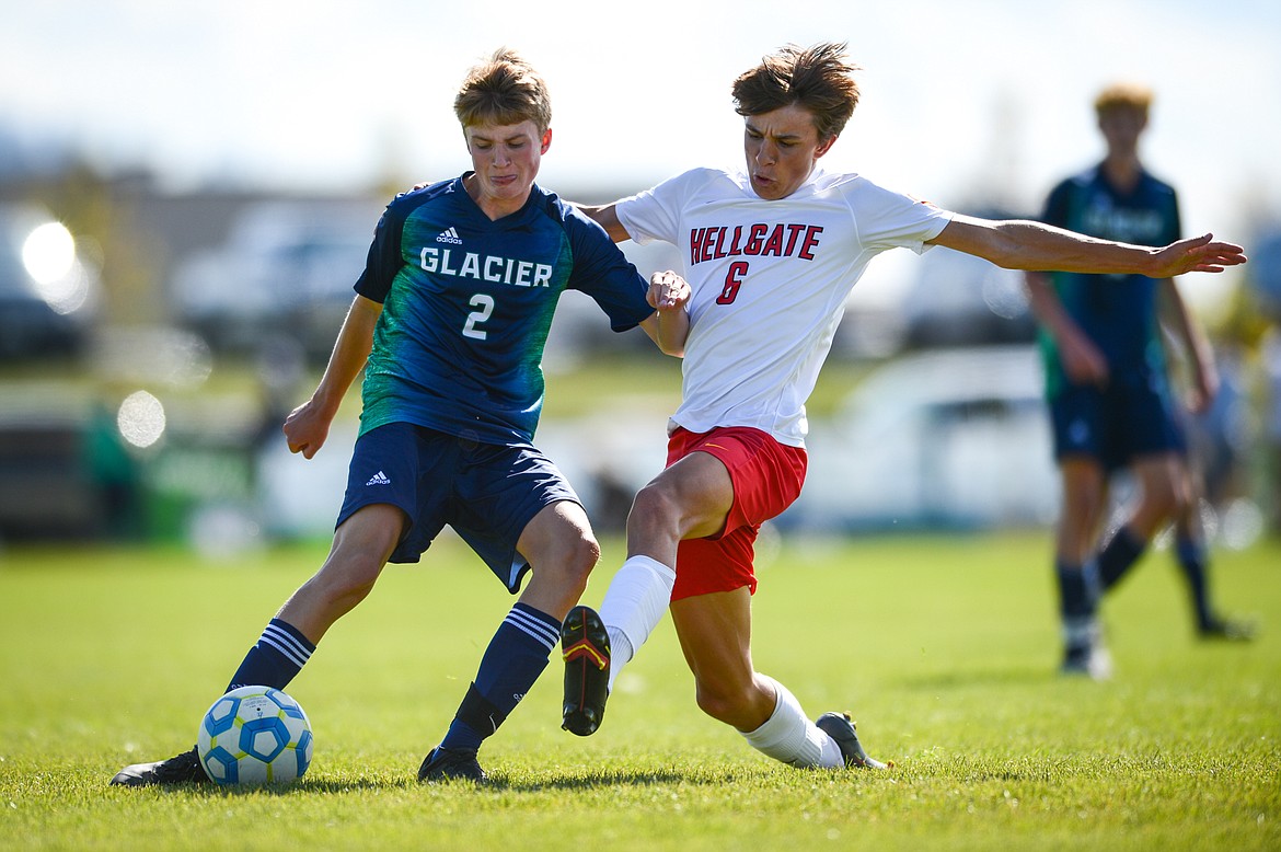 Glacier's Sam Ells (2) looks to shoot while defended by Missoula Hellgate's Henry Pierce (6) at Glacier High School on Thursday, Sept. 2. (Casey Kreider/Daily Inter Lake)