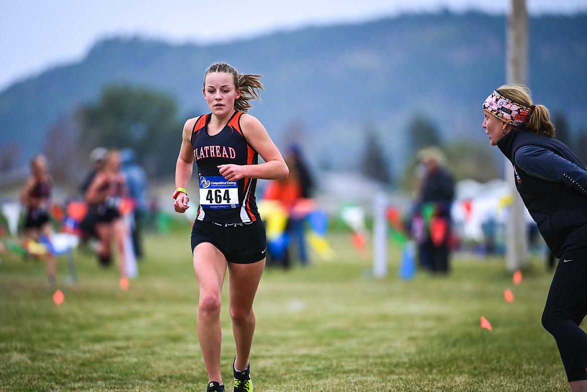 Flathead's Lilli Rumsey Eash gets some words of encouragement from her mother and Braves cross country coach Jesse Rumsey at the start of the second lap at the Glacier Invite at Rebecca Farm on Wednesday, Oct. 13. (Casey Kreider/Daily Inter Lake)