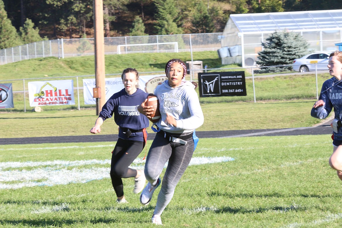 Asha Abubakari runs with the ball down field in the freshman versus sophomore game.