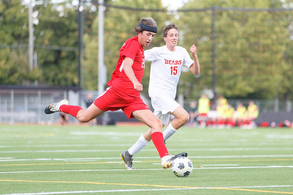 Junior Randy Lane prepares to fire a shot on goal with Moscow's Tyler Wooley nearby during a match on Aug. 31 at War Memorial Field.