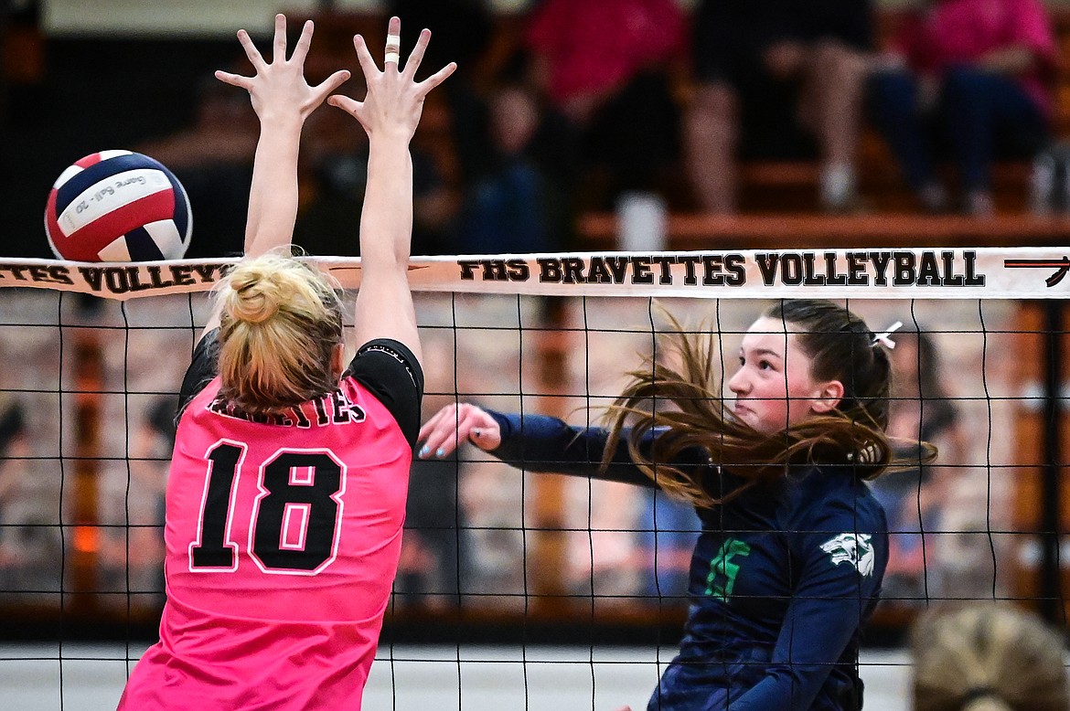 Glacier's Ella Farrell (15) looks for a kill against Flathead's Maddy Moy (18) at Flathead High School on Thursday, Oct. 14. (Casey Kreider/Daily Inter Lake)