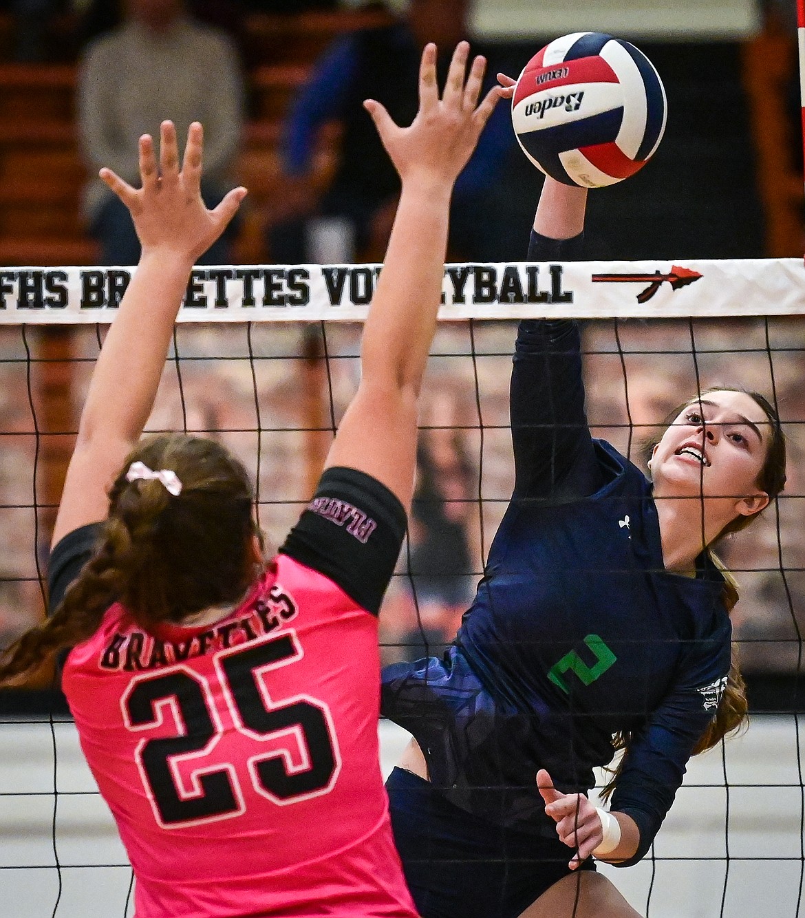 Glacier's Sidney Gulick (2) goes up for a kill against Flathead's Alliyah Stevens (25) at Flathead High School on Thursday, Oct. 14. (Casey Kreider/Daily Inter Lake)