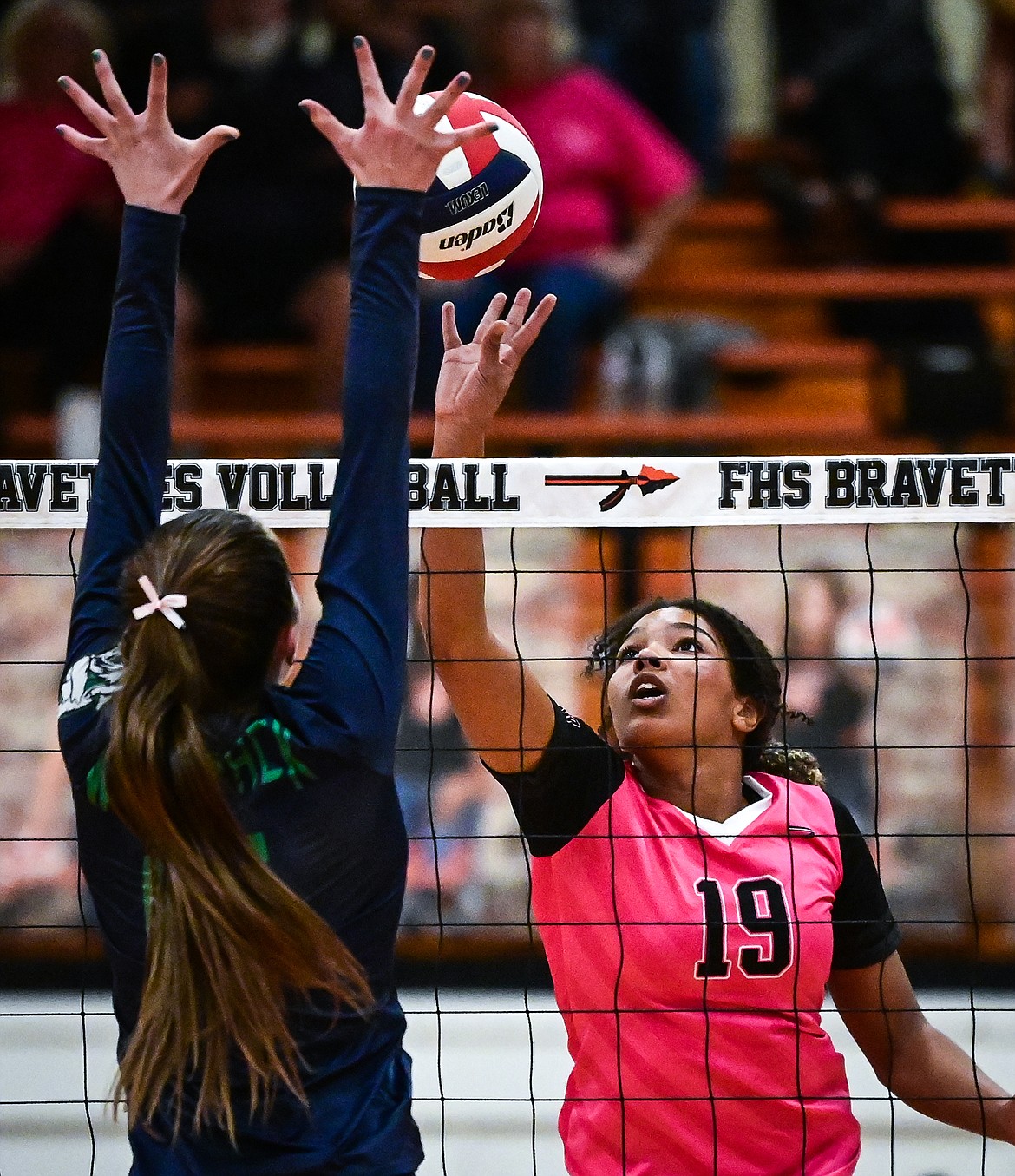 Flathead's Akilah Kubi (19) goes up for a kill against Glacier's Ella Farrell (15) at Flathead High School on Thursday, Oct. 14. (Casey Kreider/Daily Inter Lake)