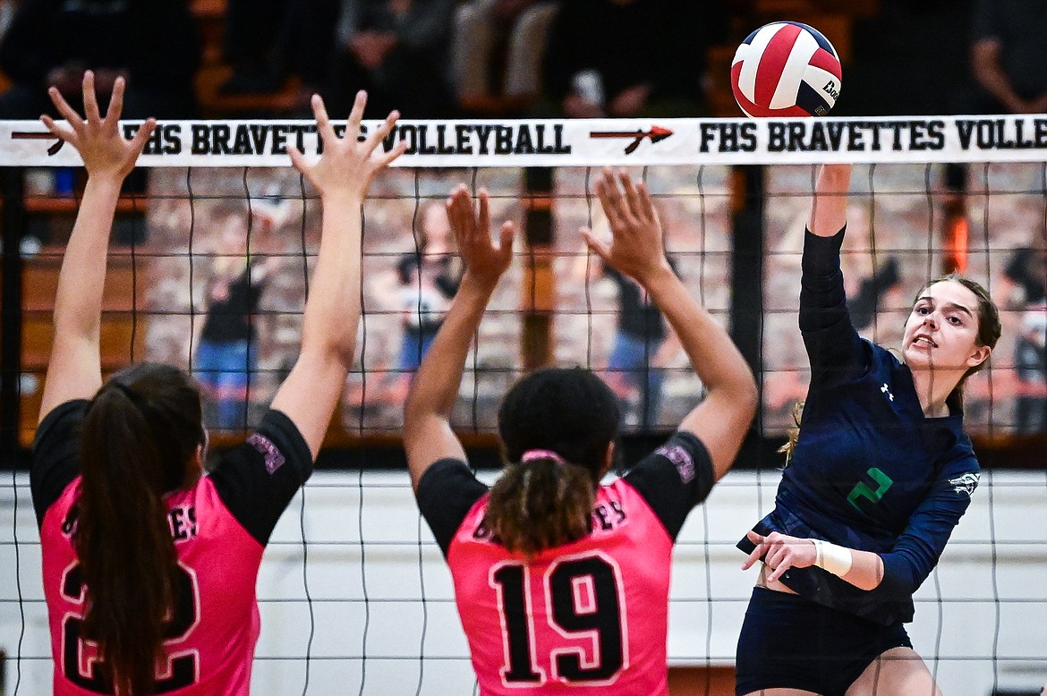 Glacier's Sidney Gulick (2) goes up for a kill against Flathead's Sienna Sterck (22) and Akilah Kubi (19) at Flathead High School on Thursday, Oct. 14. (Casey Kreider/Daily Inter Lake)