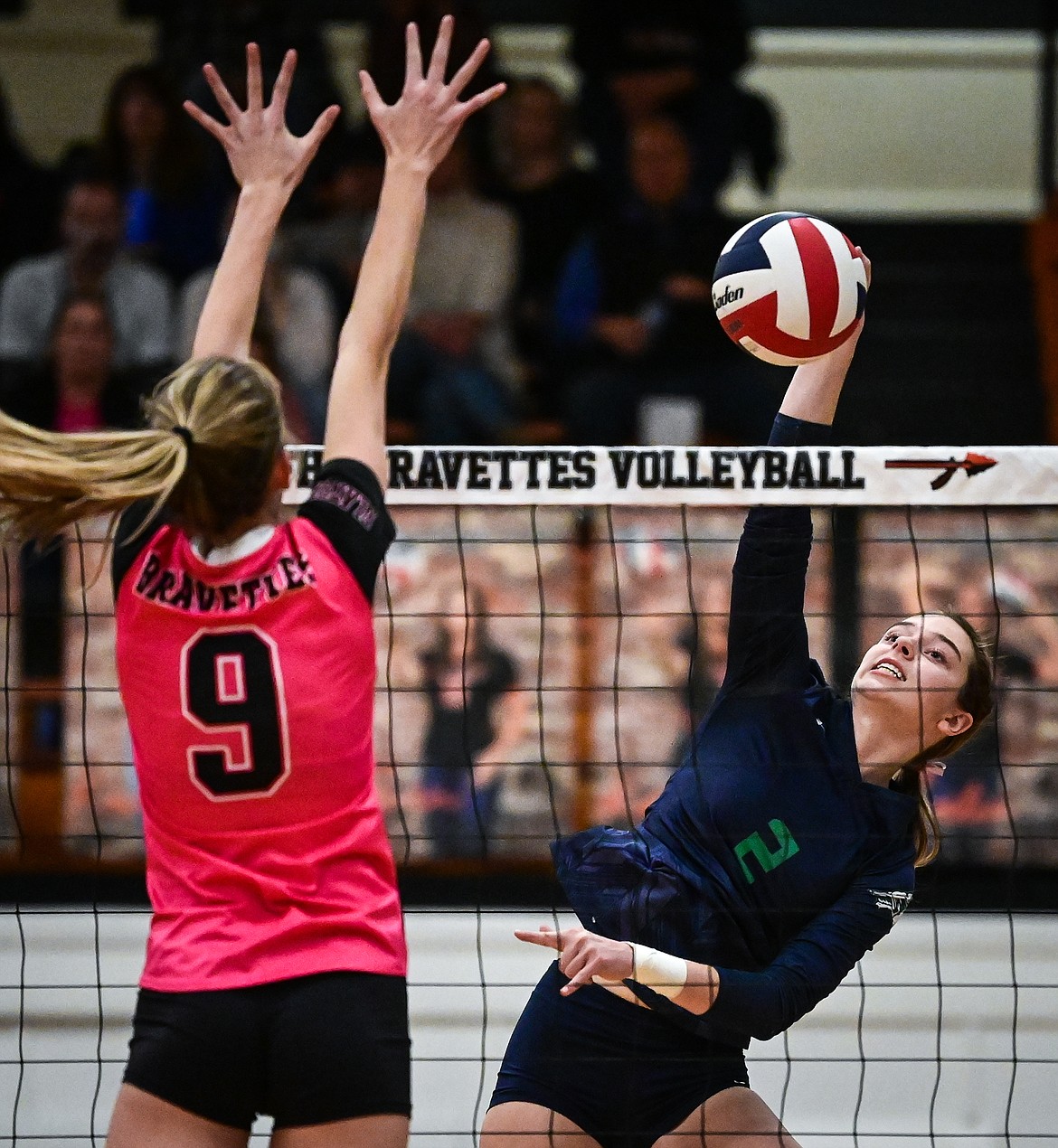 Glacier's Sidney Gulick (2) goes up for a kill against Flathead's Kennedy Moore (9) at Flathead High School on Thursday, Oct. 14. (Casey Kreider/Daily Inter Lake)