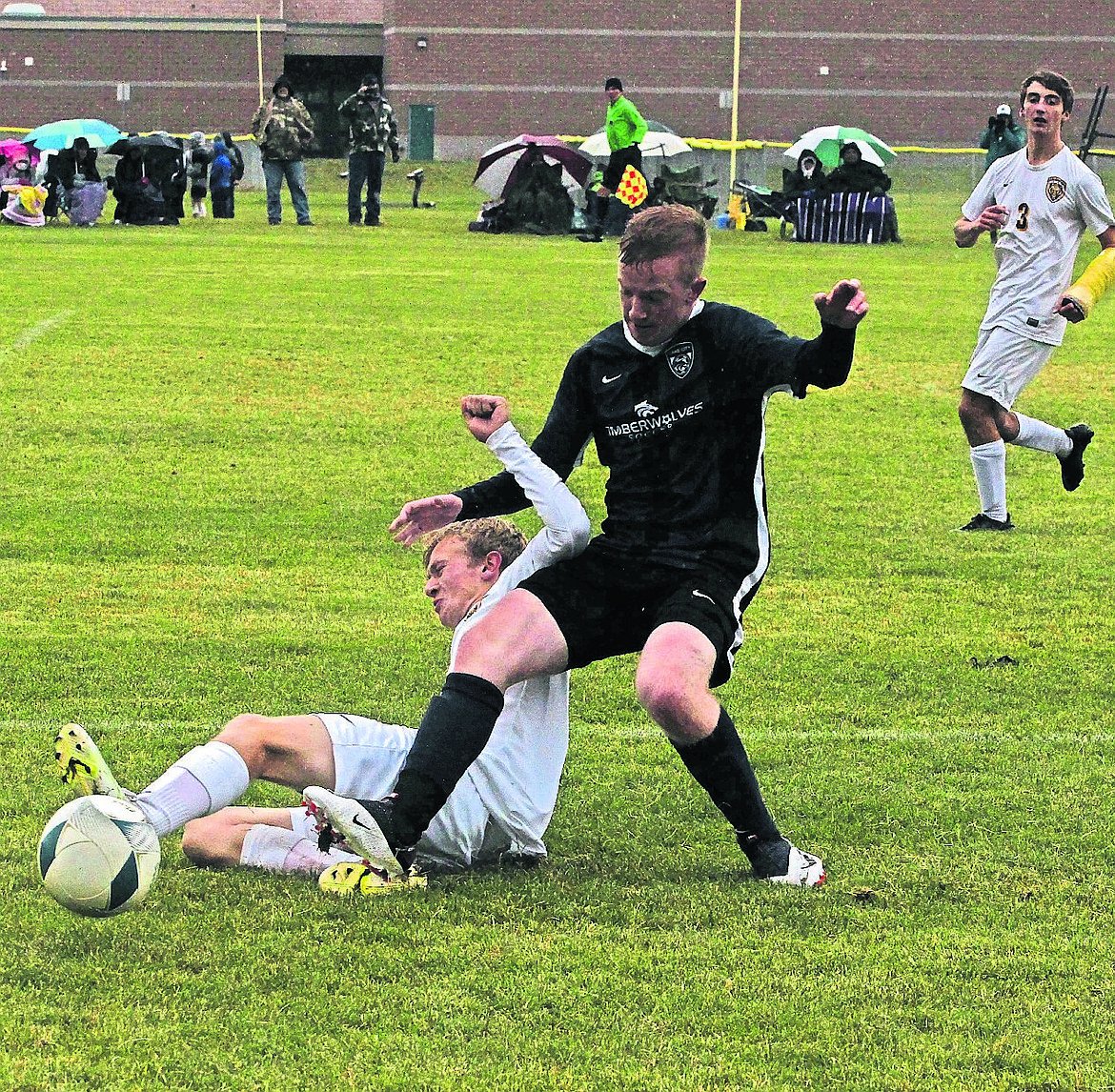 JASON ELLIOTT/Press 
Lake City midfielder Tyler Gasper beats Lewiston's Dalton Laney to the ball during the first half of Wednesday's 5A Region 1 boys soccer championship at the Irma Anderl Soccer Complex.
