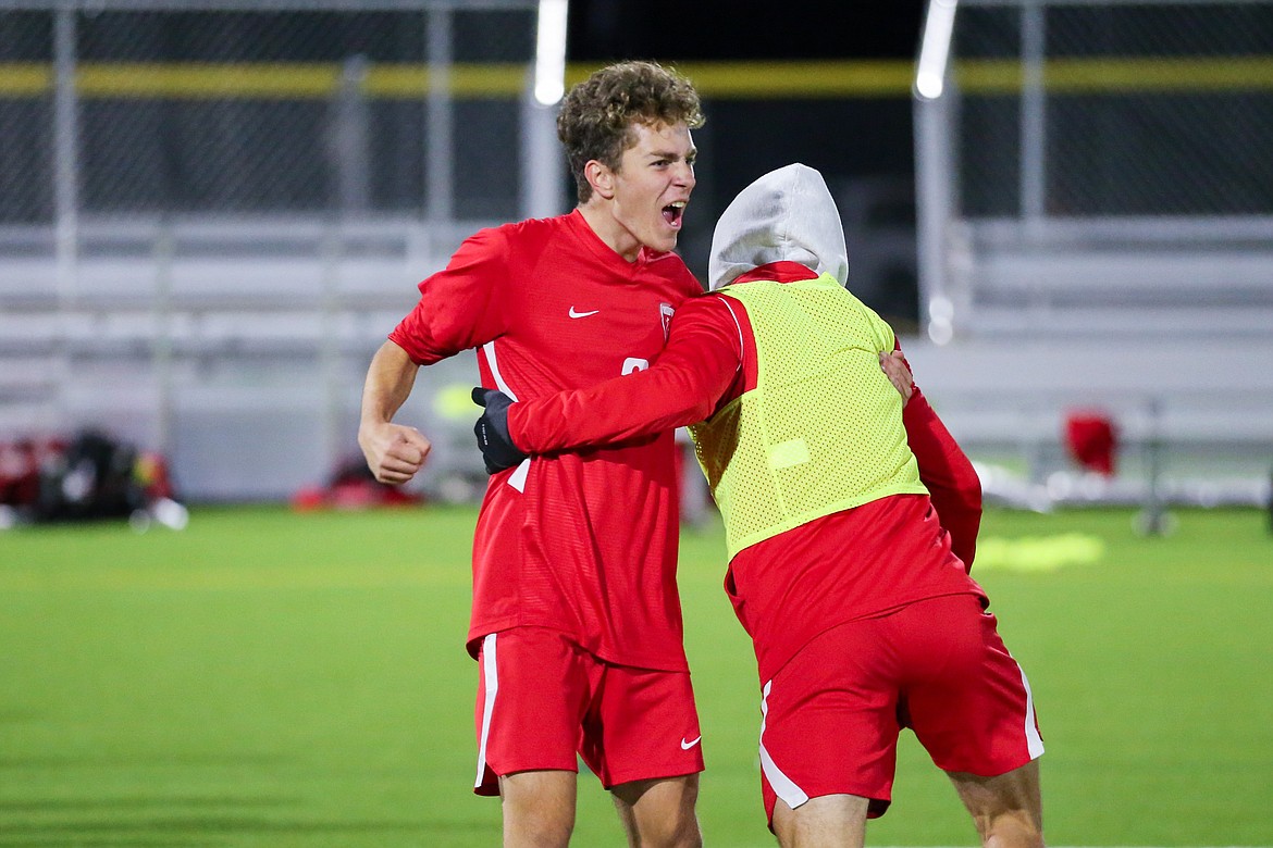 Tyler Bangle celebrates with a teammate after Thursday's victory.