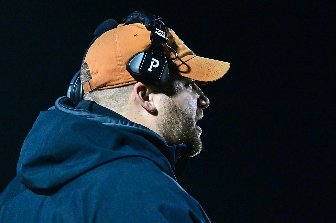 Flathead head coach Alex Cummings talks to the Braves from the sideline against Glacier at Legends Stadium on Friday, Oct. 15. (Casey Kreider/Daily Inter Lake)