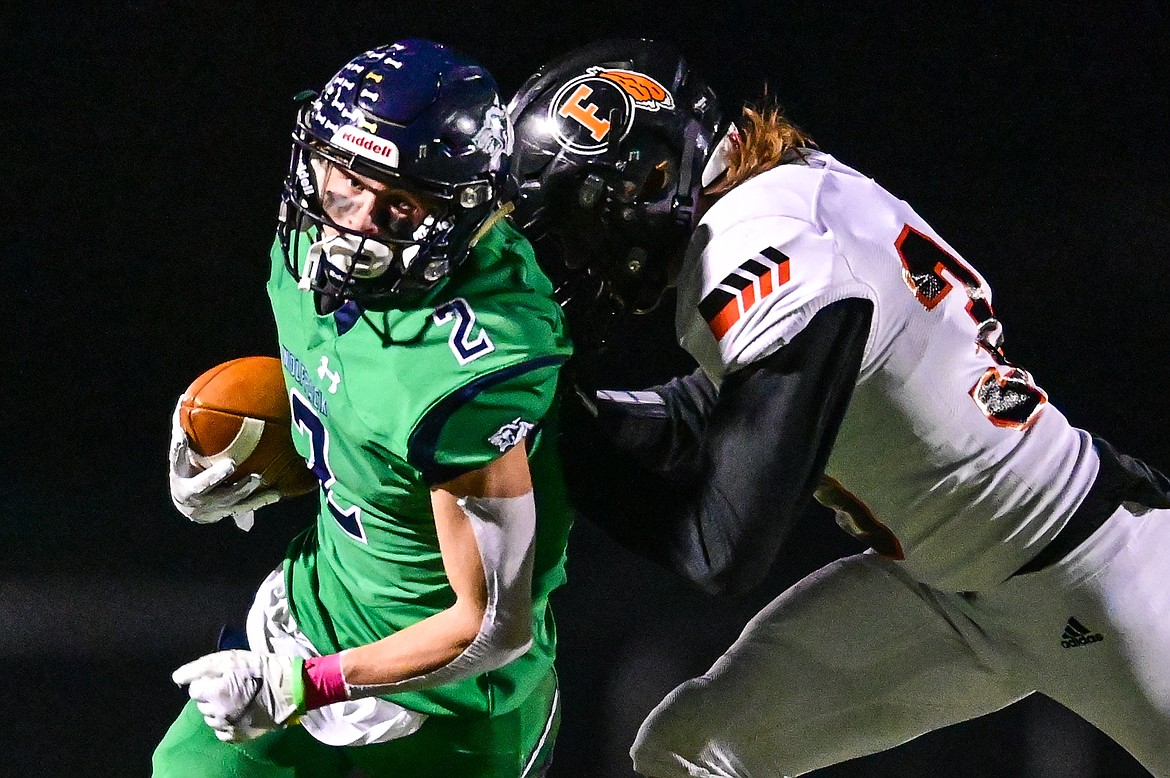 Glacier wide receiver Connor Sullivan (2) heads upfield after a reception in the first quarter against Flathead at Legends Stadium on Friday, Oct. 15. (Casey Kreider/Daily Inter Lake)