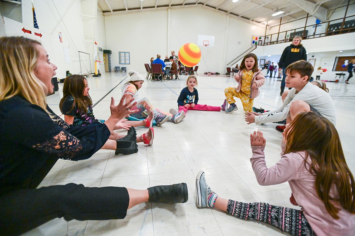 Kids and staff a game of hot potato at the Boys & Girls Clubs of Glacier Country Evergreen Clubhouse ribbon cutting event on Thursday, Oct. 14. (Casey Kreider/Daily Inter Lake)