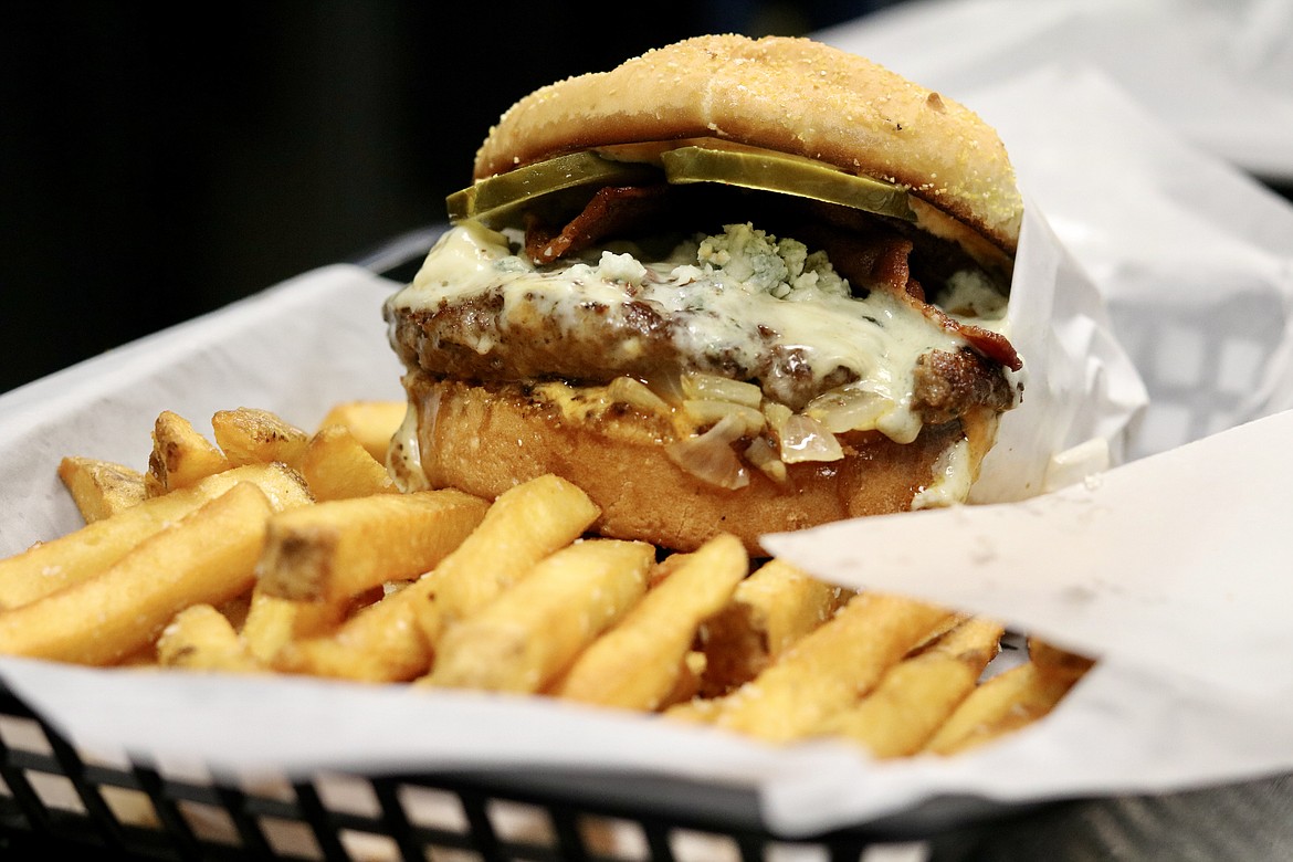 The Teemah burger has bacon, blue cheese fondu and crumbles, house sauce grilled onions and pickles joining a patty at Killer Burger, opening today in the Prairie Shopping Center in Hayden. HANNAH NEFF/Press