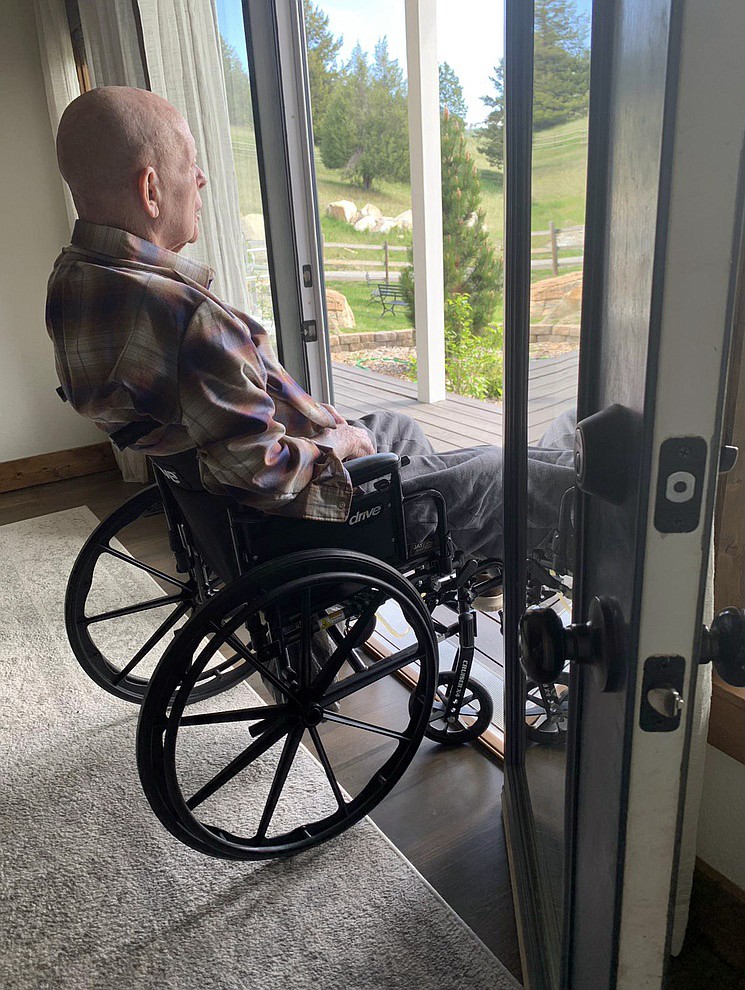 Korean War veteran Jack Pettitt takes in the view of the front yard from the home he shares with his daughter and son-in-law south of Kalispell. (photo provided)