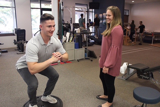 Physical Therapist Erin Blakley works with Nate English.