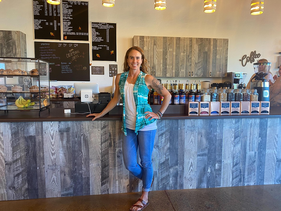 Owner Charlene Anderson stands at Cuppa Columbian Caffe.