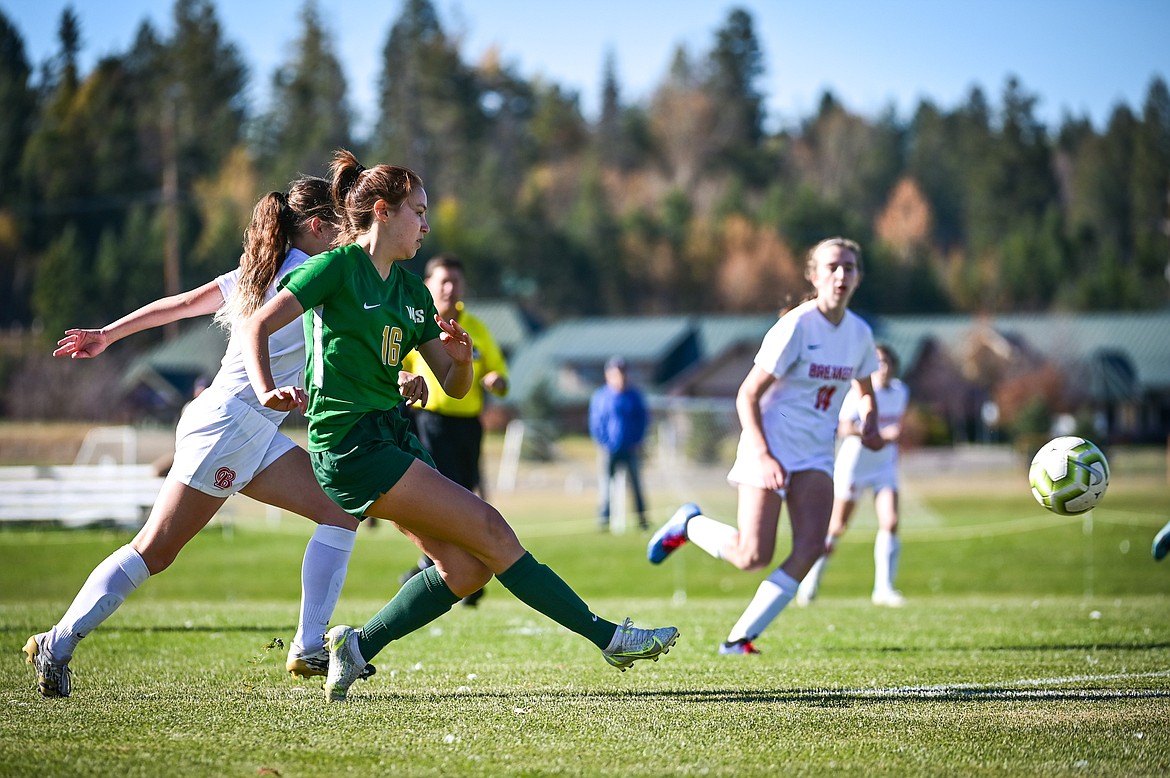 Whitefish's Adrienne Healy (16) scores a goal in the first half against Loyola Sacred Heart at Smith Fields on Saturday, Oct. 16. (Casey Kreider/Daily Inter Lake)
