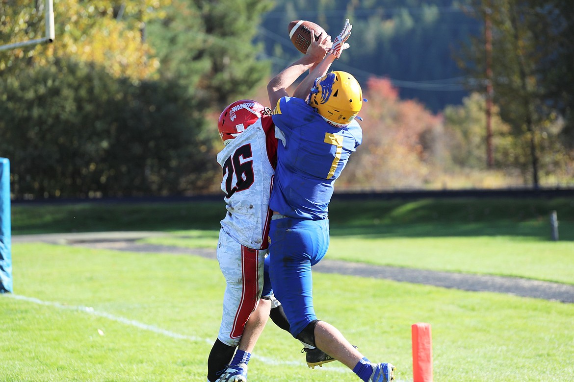 Carter Sanroman rises up to make a catch over a Kootenai defender for a two-point conversion on Saturday.