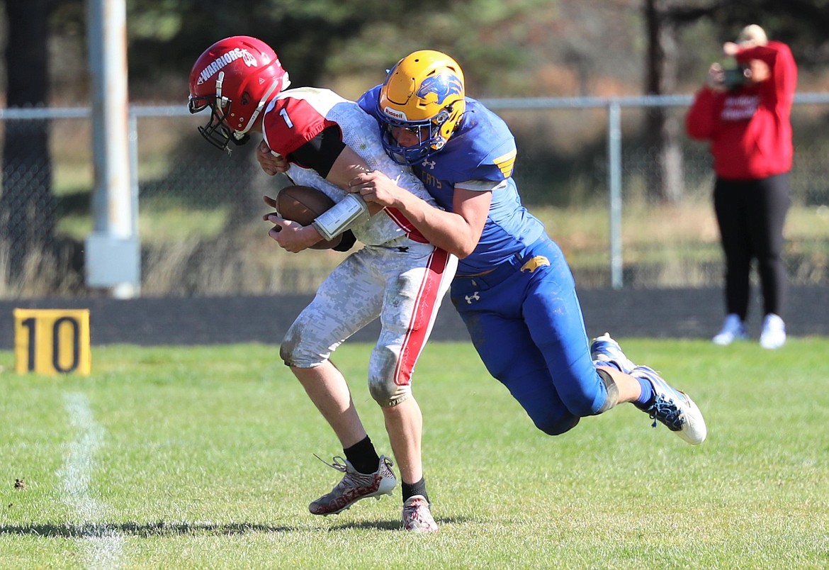 Carter Sanroman sacks the Kootenai quarterback in the second quarter on Saturday.