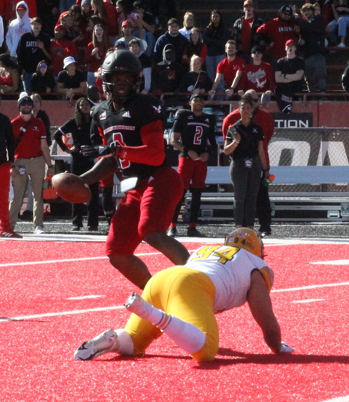 MARK NELKE/Press
Idaho's Nate DeGraw, a junior from Post Falls, has Eastern Washington quarterback Eric Barriere by the ankle in the second half on Saturday. Barriere was still able to get off his pass, though it fell incomplete.