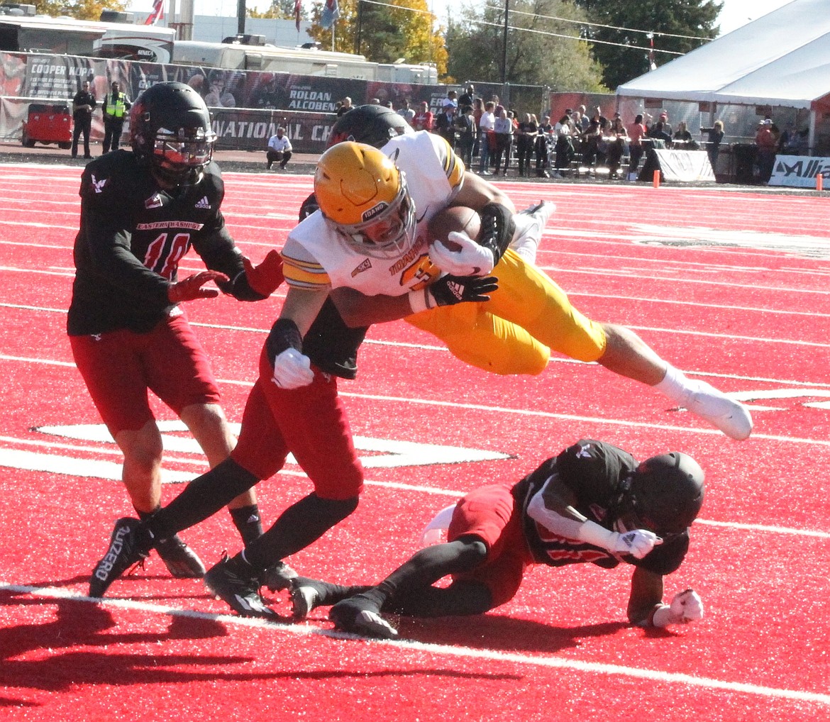 MARK NELKE/Press
Idaho's Nick Romano is upended as he tries to score in the first half against Eastern Washington on Saturday in Cheney.