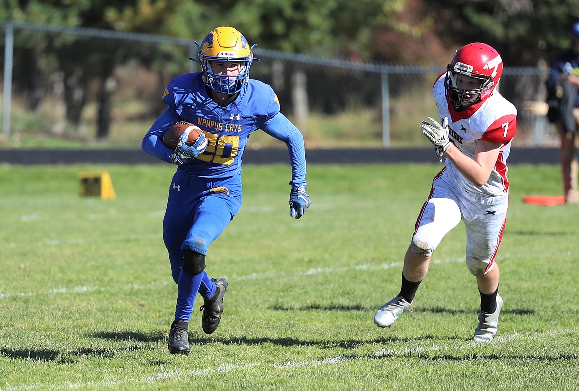 Sam Barnett carries the ball during Saturday's game against Kootenai.