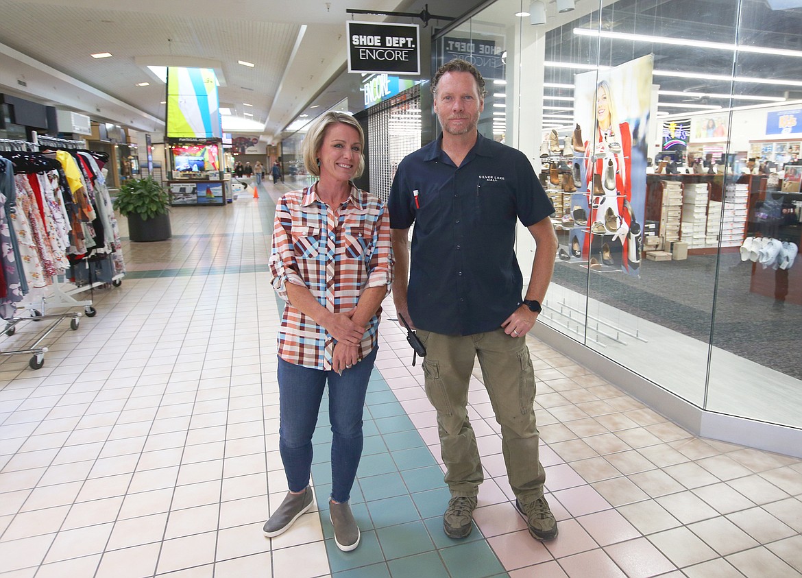 Silver Lake mall manager Melissa Schock and senior maintenance mechanic Jason Berry stop for a photo on Friday.