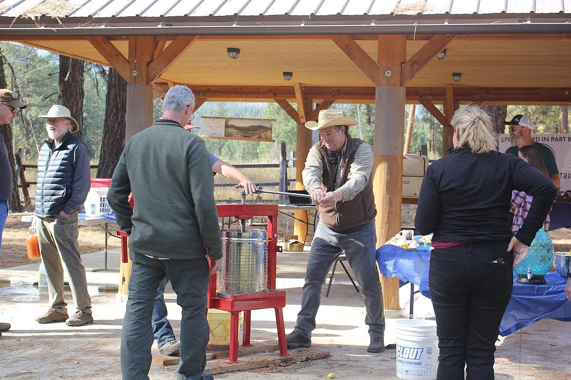 Mineral County residents had a good time turning apples into cider during a recent event. (Monte Turner/Mineral Independent)