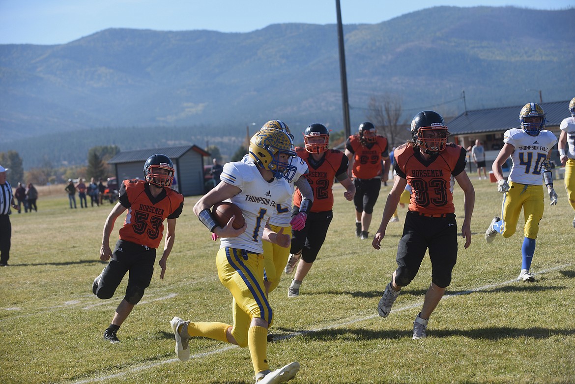 Thompson Falls quarterback Eli Ratliff scored three touchdowns in last Saturday’s 61-6 win over Plains. Ratliff ran for a score, threw a TD pass and returned an interception for another six points. (Scott Shindledecker/Valley Press)