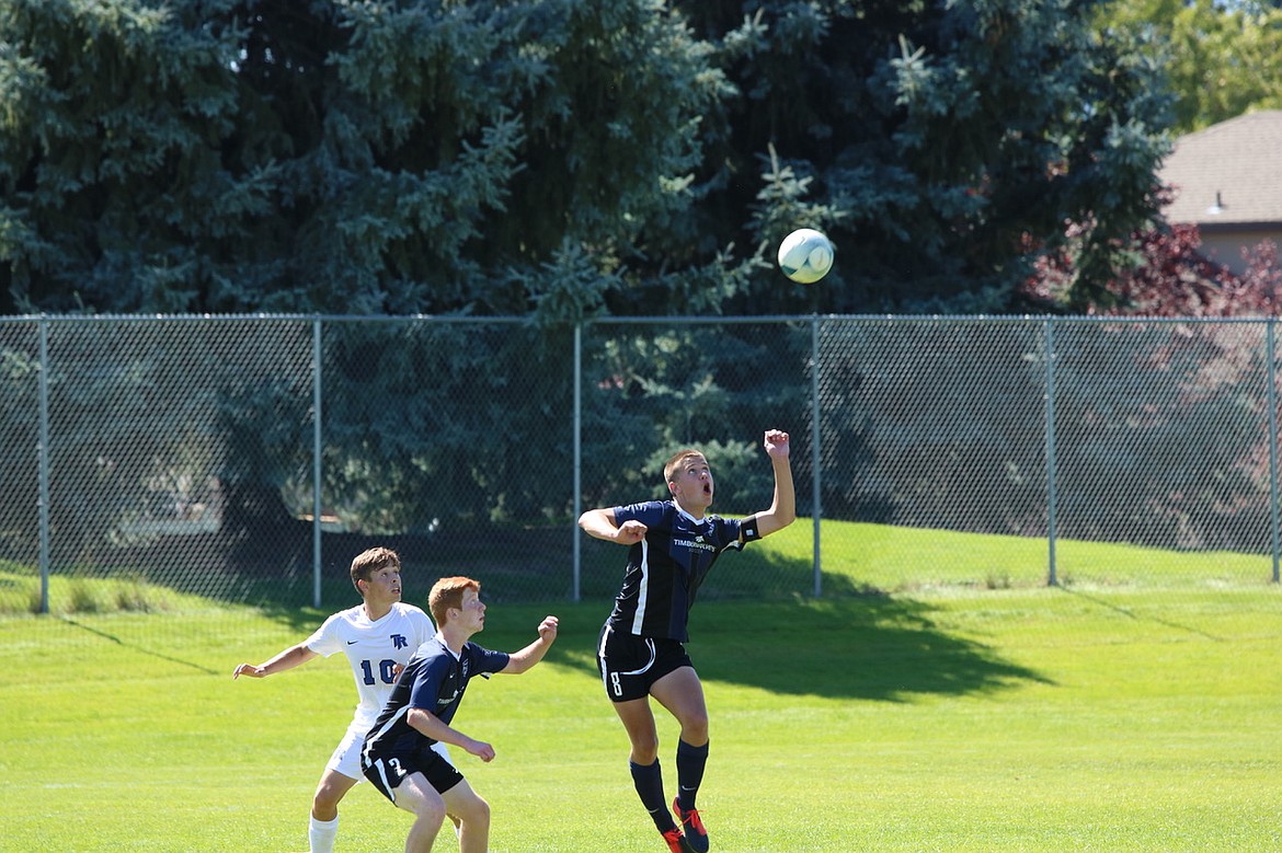 Photo by ZAC CHAN
Lake City senior defender Miles Jones (8) attempts to play the ball in the air during a home match against Thunder Ridge in August.