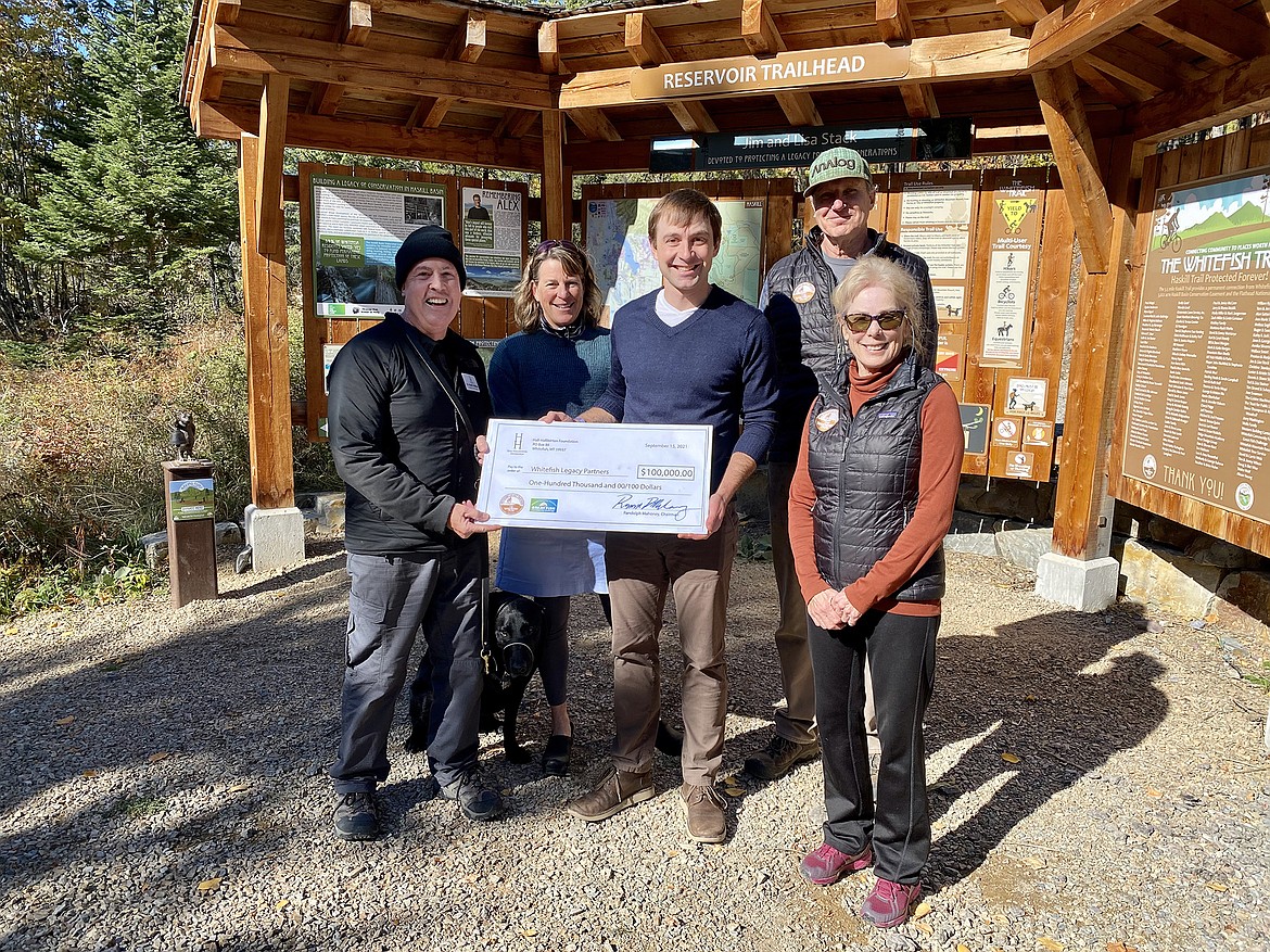 Hall-Halliburton Foundation Chairman Randolph Mahoney, Axel the dog, Whitefish Legacy Partners Executive Director Heidi Van Everen, WLP Director of Development Alan Davis, and WLP Board Members Mike Jopek and Becky Smith-Powell. (Courtesy photo)