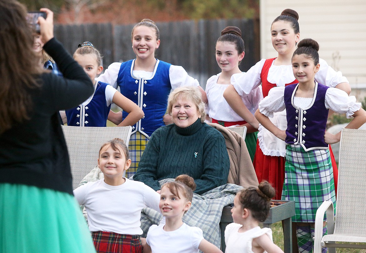 Geri Nicoll poses with members of the Lake City High Dance team that performed for her surprise Irish party on Sunday.