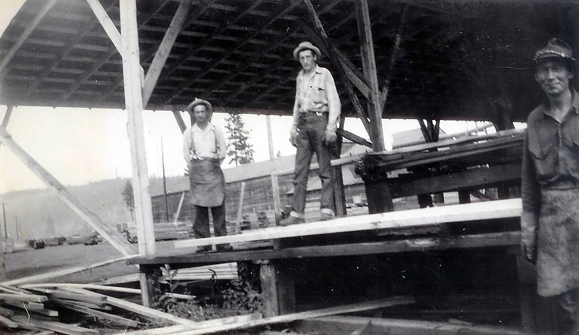 A photo from the Moyie River Lumber Company. Pictured, from left, are John Ruhberg, “Trac,” and Albert Sormo.