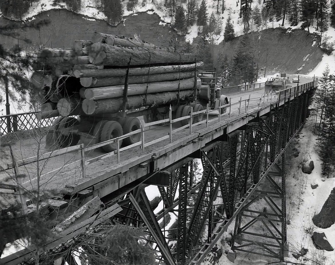 A photo of a logging truck crossing the old Moyie Bridge (circa 1950s-'60s.)