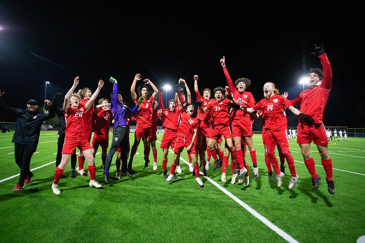 The Sandpoint boys soccer team celebrates after claiming the 4A Region 1 title over Moscow last season at War Memorial Field.