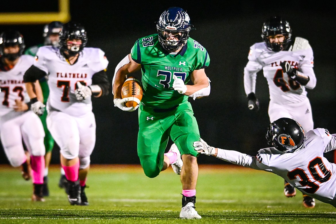 Glacier running back Jake Rendina (33) breaks loose in the second quarter against Flathead at Legends Stadium on Friday, Oct. 15. (Casey Kreider/Daily Inter Lake)