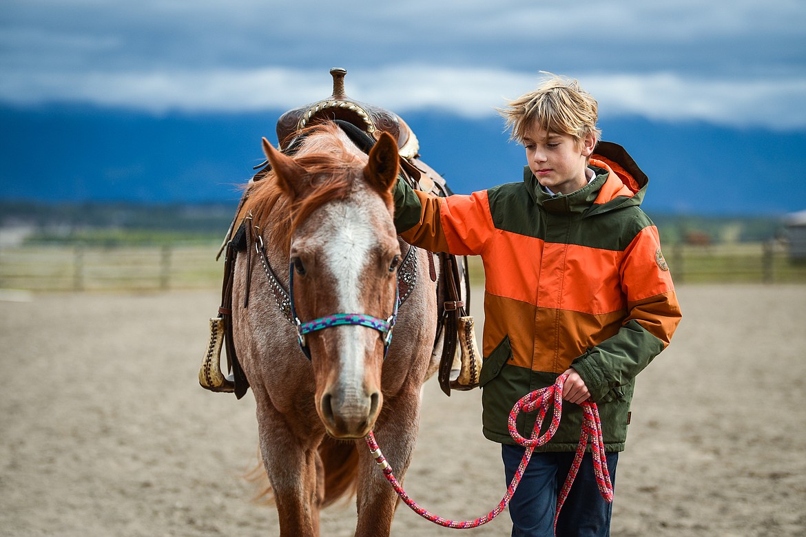 Whitefish Christian Academy seventh-grader Cooper Dudley walks a horse named Hammer around the arena at Lost Creek Ranch on Friday, Oct. 15. (Casey Kreider/Daily Inter Lake)