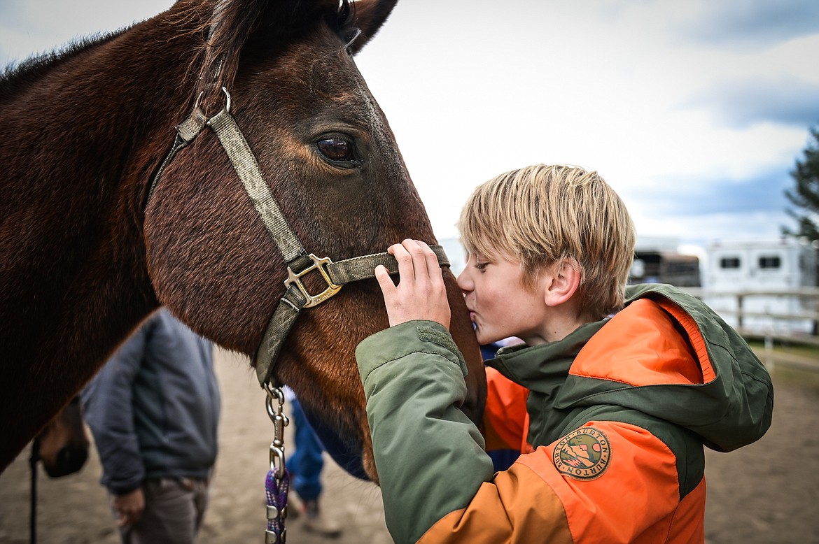 Whitefish Christian Academy seventh-grader Cooper Dudley kisses a horse on the nose in between instruction at Lost Creek Ranch on Friday, Oct. 15. (Casey Kreider/Daily Inter Lake)