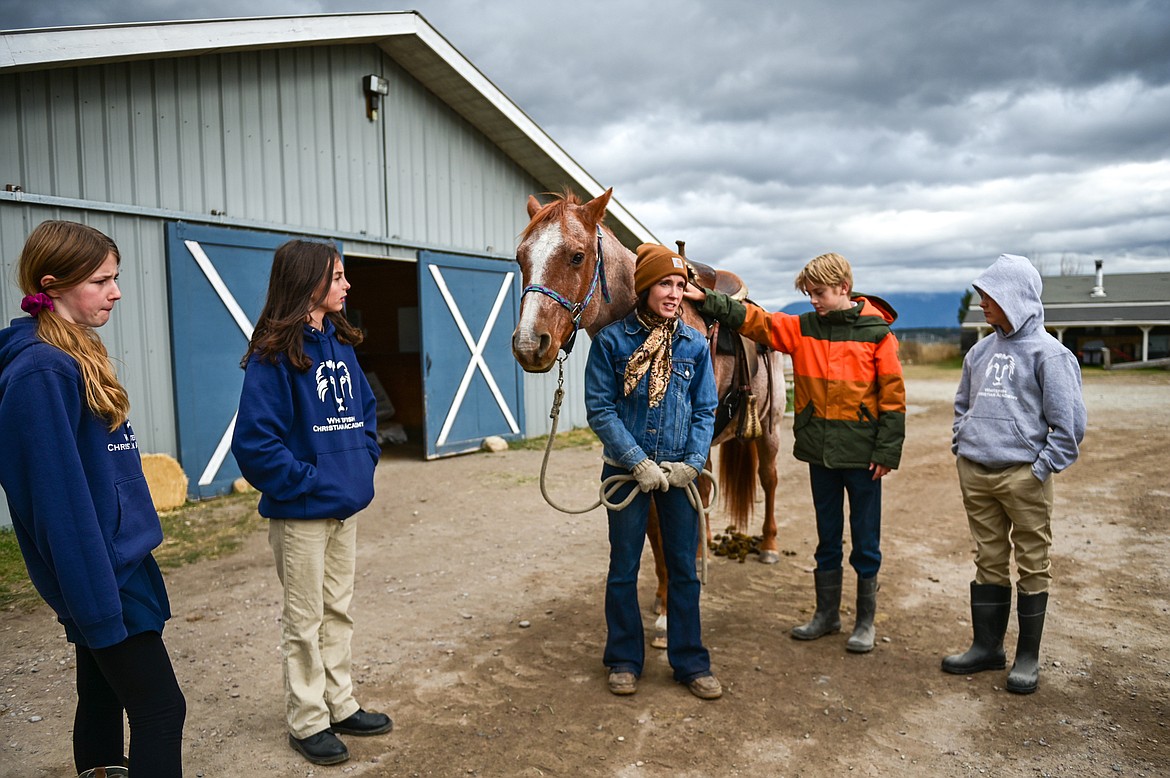 Lost Creek Ranch instructor and owner Chanel Olson goes over some ground rules and introduces seventh-grade students from Whitefish Christian Academy to one of the ranch's horses named Hammer on Friday, Oct. 15. (Casey Kreider/Daily Inter Lake)