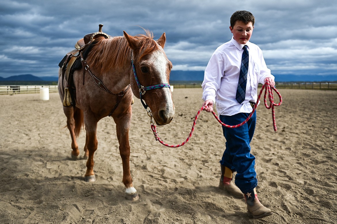 Whitefish Christian Academy seventh-grader Ashton Gibson walks a horse named Hammer around the arena at Lost Creek Ranch on Friday, Oct. 15. (Casey Kreider/Daily Inter Lake)