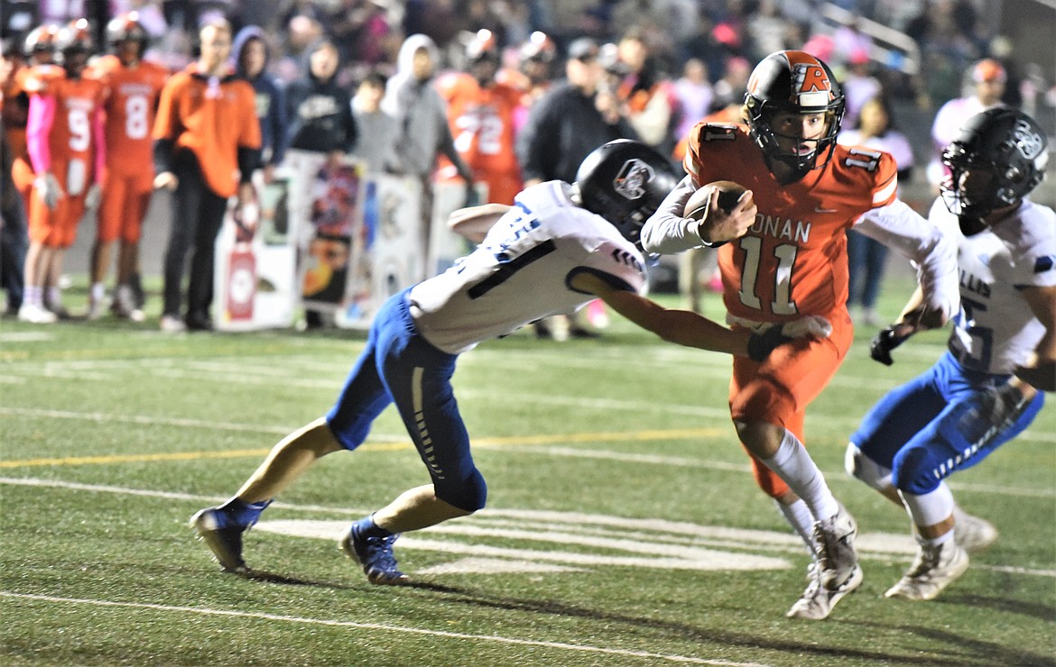 Ronan quarterback Caleb Cheff heads for the end zone on a keeper against Corvallis. (Scot Heisel/Lake County Leader)