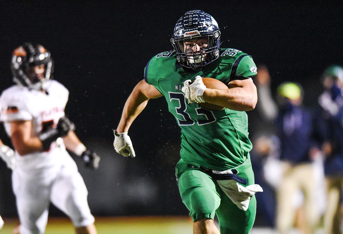 Glacier running back Jake Rendina (33) heads to the end zone on a 34-yard touchdown reception in the second quarter against Flathead during crosstown football at Legends Stadium on Friday. (Casey Kreider/Daily Inter Lake)