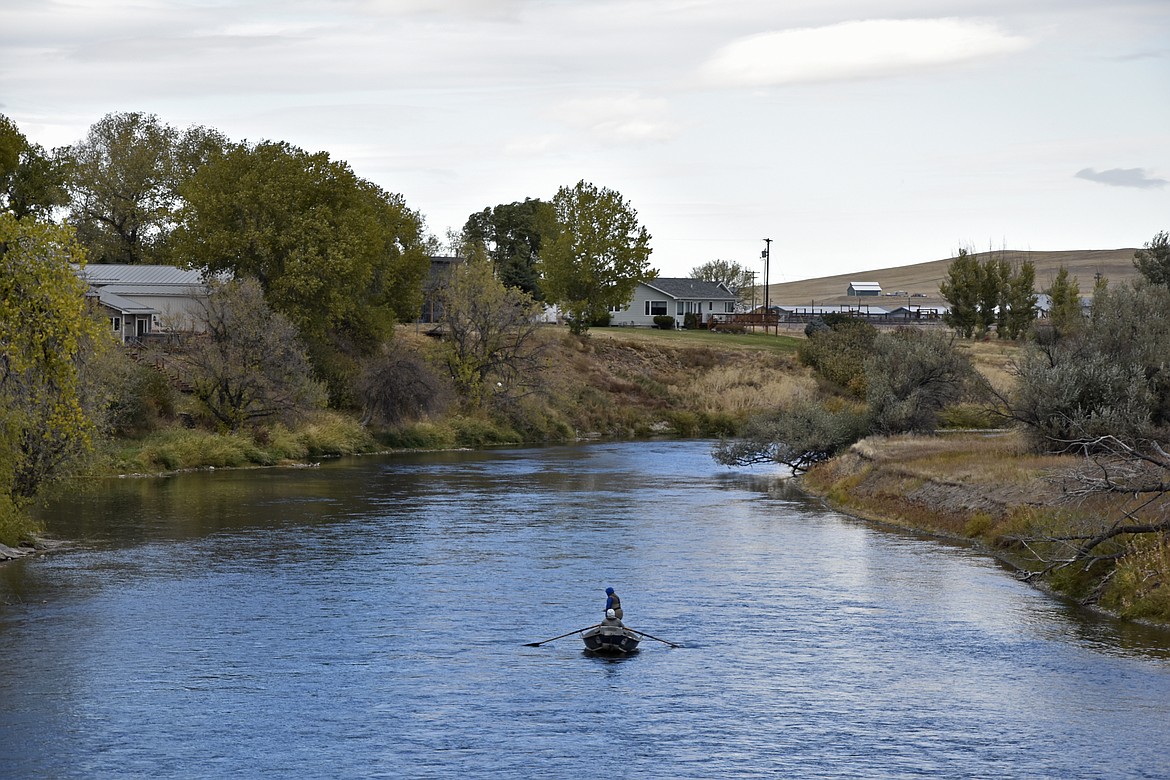 The Missouri River flows through Cascade, Mont., on Friday, Oct. 15, 2021. Incorporated 110 years ago, Cascade has changed little since then -- aside from a recent upgrade of the town's water and sewage pipes. For the first time in 30 years, the Census has awarded Montana a second seat in Congress and a commission is being tasked with determining how to divide the state into two congressional districts. (AP Photo/Iris Samuels)