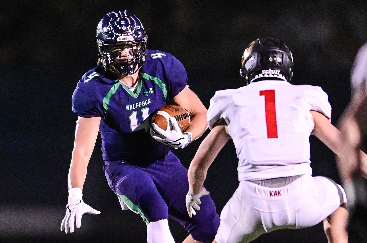 Glacier tight end Luke Bilau (4) looks for running room after a reception in the first quarter against Missoula Hellgate at Legends Stadium on Thursday, Oct. 21. (Casey Kreider/Daily Inter Lake)