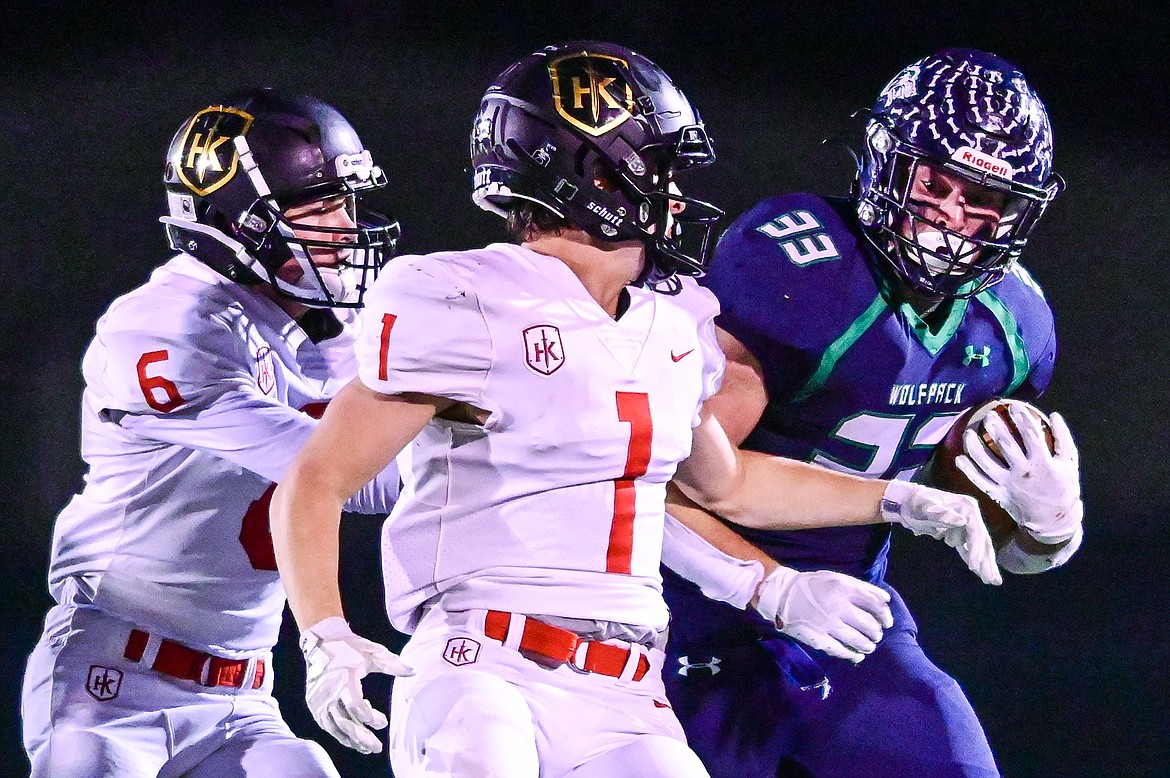 Glacier running back Jake Rendina (33) breaks a 33-yard run in the second quarter against Missoula Hellgate at Legends Stadium on Thursday, Oct. 21. (Casey Kreider/Daily Inter Lake)